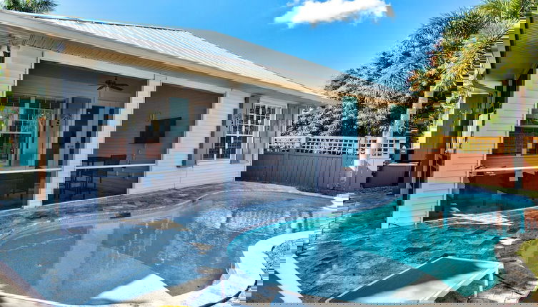 Photo 1 - Sardinia Vacation Rental: Delightful Coastal Home near Vanderbilt Beach. Relax in a Private Pool and Spacious 4-BR Retreat with Modern Amenities. Ideal for Families. Minutes from Mercato and Local Attractions