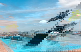 Foto 1 - Riveria City by Plush