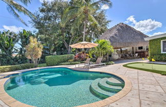 Photo 1 - Tropical Palm Beach Escape w/ Outdoor Paradise