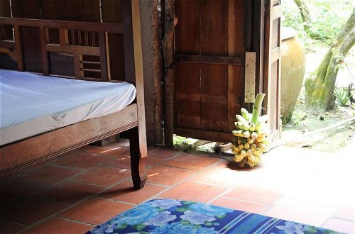Foto 4 - Peaceful Homestay in the Middle of Fruit Garden - Room With Four Double Beds