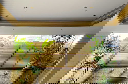 Foto 18 - Charming Royal Garden Condo by RedAwning