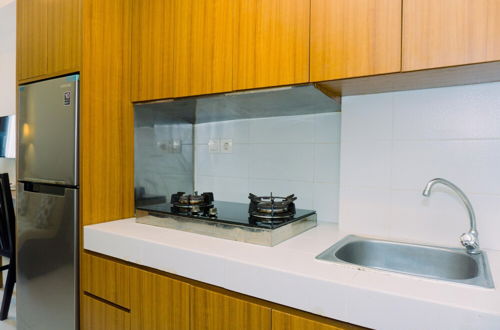 Photo 8 - Warm And Minimalist 1Br Apartment At Scientia Residence