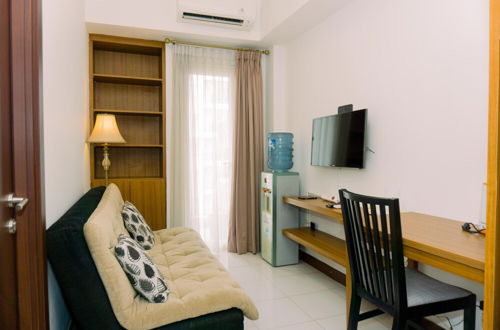 Photo 9 - Warm And Minimalist 1Br Apartment At Scientia Residence