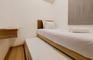 Photo 1 - Warm And Comfort Stay 2Br At Sky House Bsd Apartment