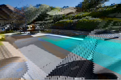Photo 5 - Oasi di Castelveccana Apt Pool and View