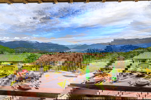 Photo 3 - Oasi di Castelveccana Apt Pool and View