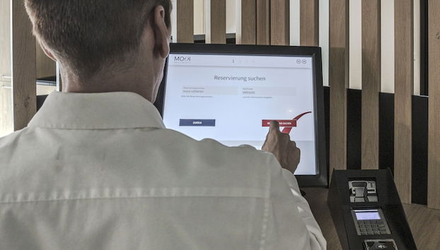 Check-in/check-out kiosk