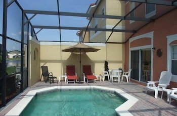 Photo 11 - 4br, 3ba T/home W/ Screened-in Heated Pool 4 Bedroom Townhouse by Redawning