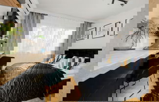 Photo 1 - Black & Wooden Apartment by Renters