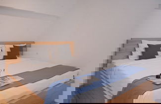 Foto 1 - Comfort Studio Loft Apartment At Kingland Avenue