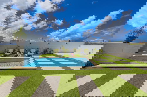 Photo 36 - Brand NEW 3BR w Private Pool Walk to Palm Beach
