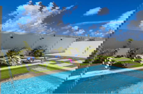 Photo 11 - Brand NEW 3BR w Private Pool Walk to Palm Beach