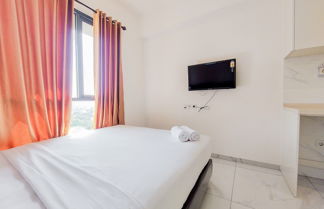 Foto 3 - Cozy And Comfort Studio Sky House Alam Sutera Apartment