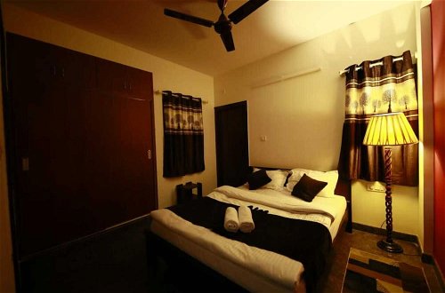 Foto 5 - Tranquil Orchid Serviced Apartment
