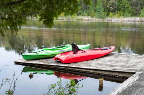 Photo 12 - Luxe Riverfront Lodge by Torch Lake With Kayaks