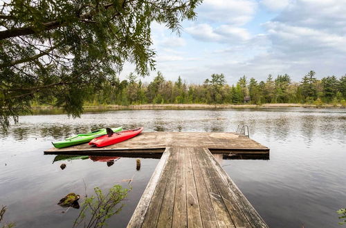 Photo 28 - Luxe Riverfront Lodge by Torch Lake With Kayaks