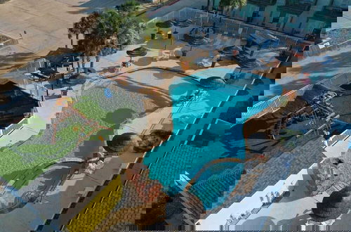 Foto 1 - Shared Resort-style Pool, Playground, Patio w/ Bar Tidal Times by Avantstay