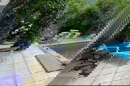 Foto 11 - Uitzicht op het Zwembad