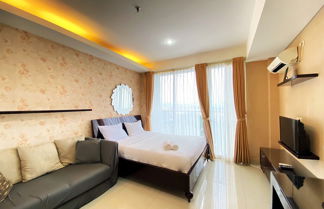 Photo 2 - Warm And Cozy Studio At Dago Suites Apartment