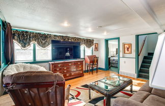 Photo 3 - Colorful Cottage w/ Hot Tub - Steps to Long Lake