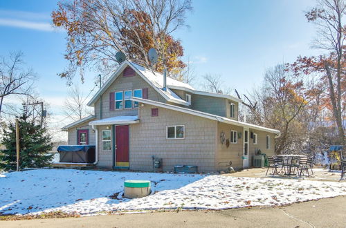 Photo 1 - Colorful Cottage w/ Hot Tub - Steps to Long Lake