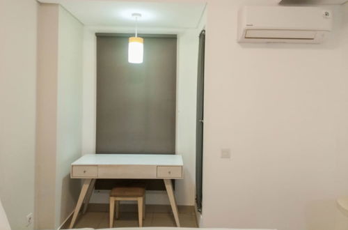 Photo 2 - Cozy Studio At Barsa City Apartment