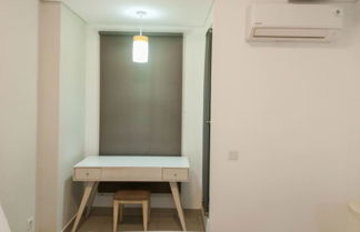 Photo 2 - Cozy Studio At Barsa City Apartment
