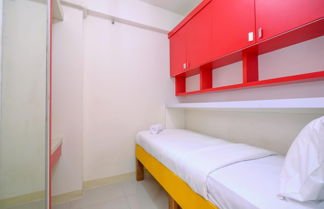 Photo 3 - Comfort Designed 2Br At Green Pramuka City Apartment