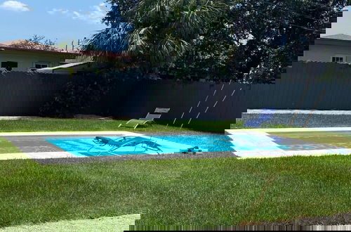 Photo 14 - Boho Chic: 3BR Home With Pool