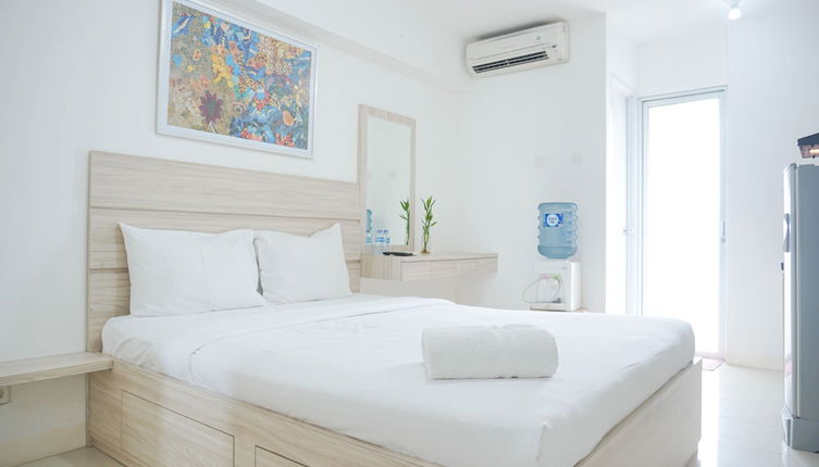 Photo 1 - Cozy Stay and Homey Studio Apartment at Bassura City Apartment