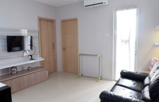 Foto 1 - Comfort 1BR Apartment with Sofa Bed connected to Mall Bassura City