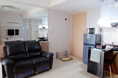 Photo 23 - Comfort 1BR Apartment with Sofa Bed connected to Mall Bassura City