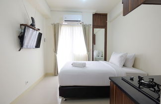 Photo 1 - Comfy Studio Apartment @ Green Pramuka City