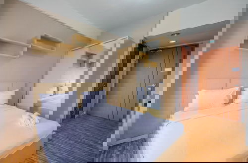 Foto 3 - Cozy Stay And Warm Studio Apartment At Margonda Residence 5