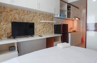 Photo 3 - Compact And Cozy Studio Apartment At Orchard Supermall Mansion