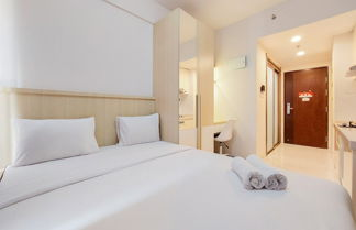 Photo 1 - Warm And Comfortable Studio Room At Sky House Bsd Apartment