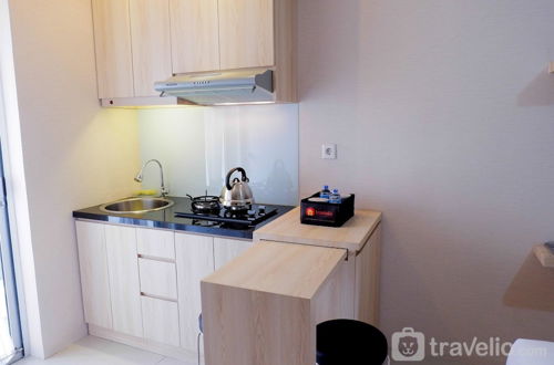 Photo 11 - Cozy Studio at Bassura Apartment near to Bassura Mall