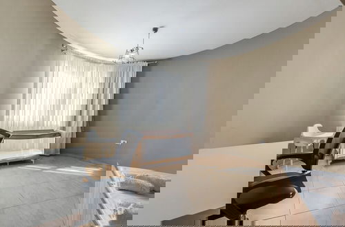Foto 5 - Kondo Stays - City Center Apartments