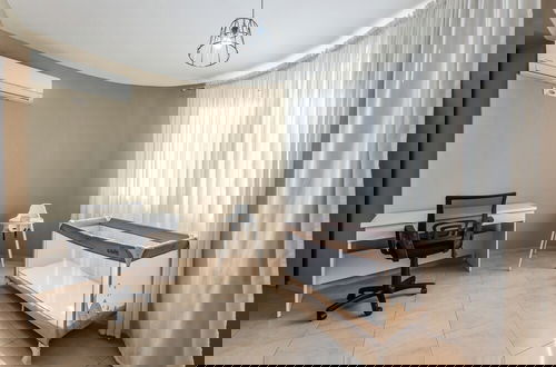 Foto 1 - Kondo Stays - City Center Apartments