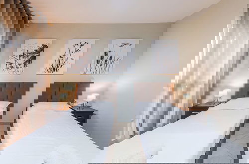 Foto 3 - Kondo Stays - City Center Apartments