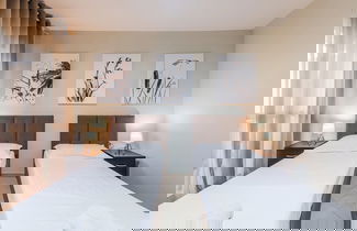 Foto 3 - Kondo Stays - City Center Apartments