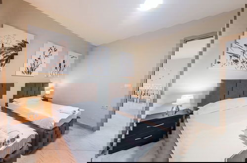 Foto 2 - Kondo Stays - City Center Apartments