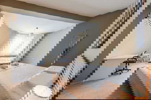 Foto 9 - Kondo Stays - City Center Apartments