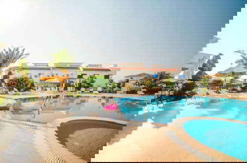 Photo 1 - Sunny and Family Friendly Apartment Directly at the Pool