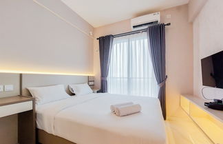 Photo 1 - Cozy Living And Warm Studio Sky House Bsd Apartment