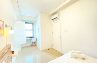 Photo 1 - Cheerful And Homey 2Br Apartment At Parahyangan Residence