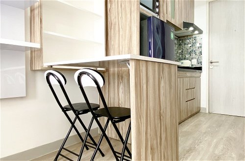 Photo 9 - Homey And Compact Studio At Azalea Suites Apartment