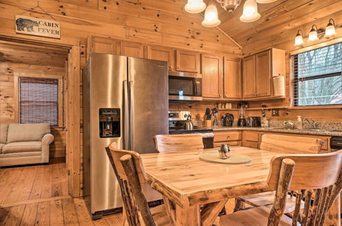 Photo 7 - Riverfront Cabin w/ Hot Tub & Mountain Views