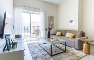 Photo 1 - Signature Living in Modern 1BR Apartment at Jvt