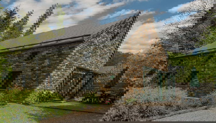 Photo 1 - Rustic Holiday Home with Sauna & Hot Tub in Wooded Area